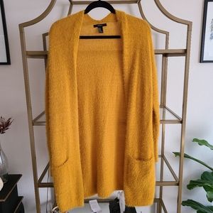 fuzzy yellow sweater